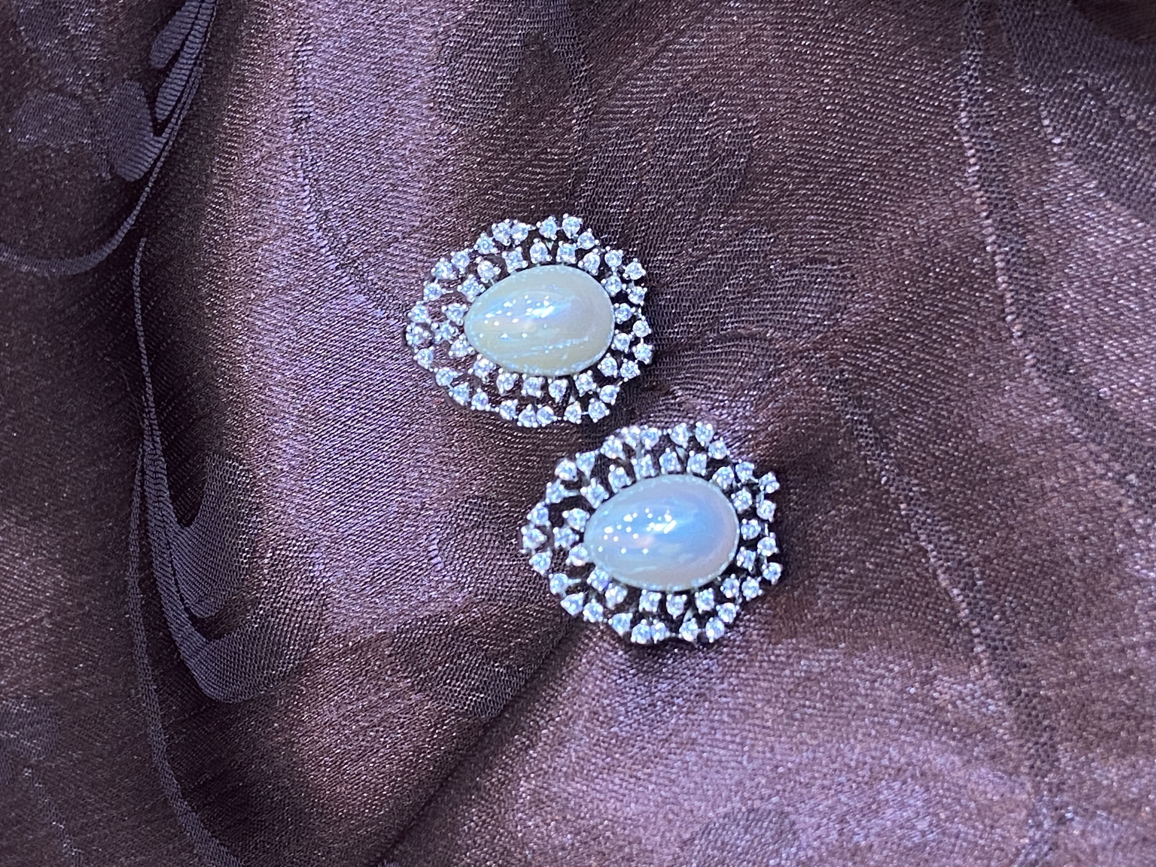 OVAL SHAPED SILVER DIAMONDS WITH CENTRE PEARL TOPS